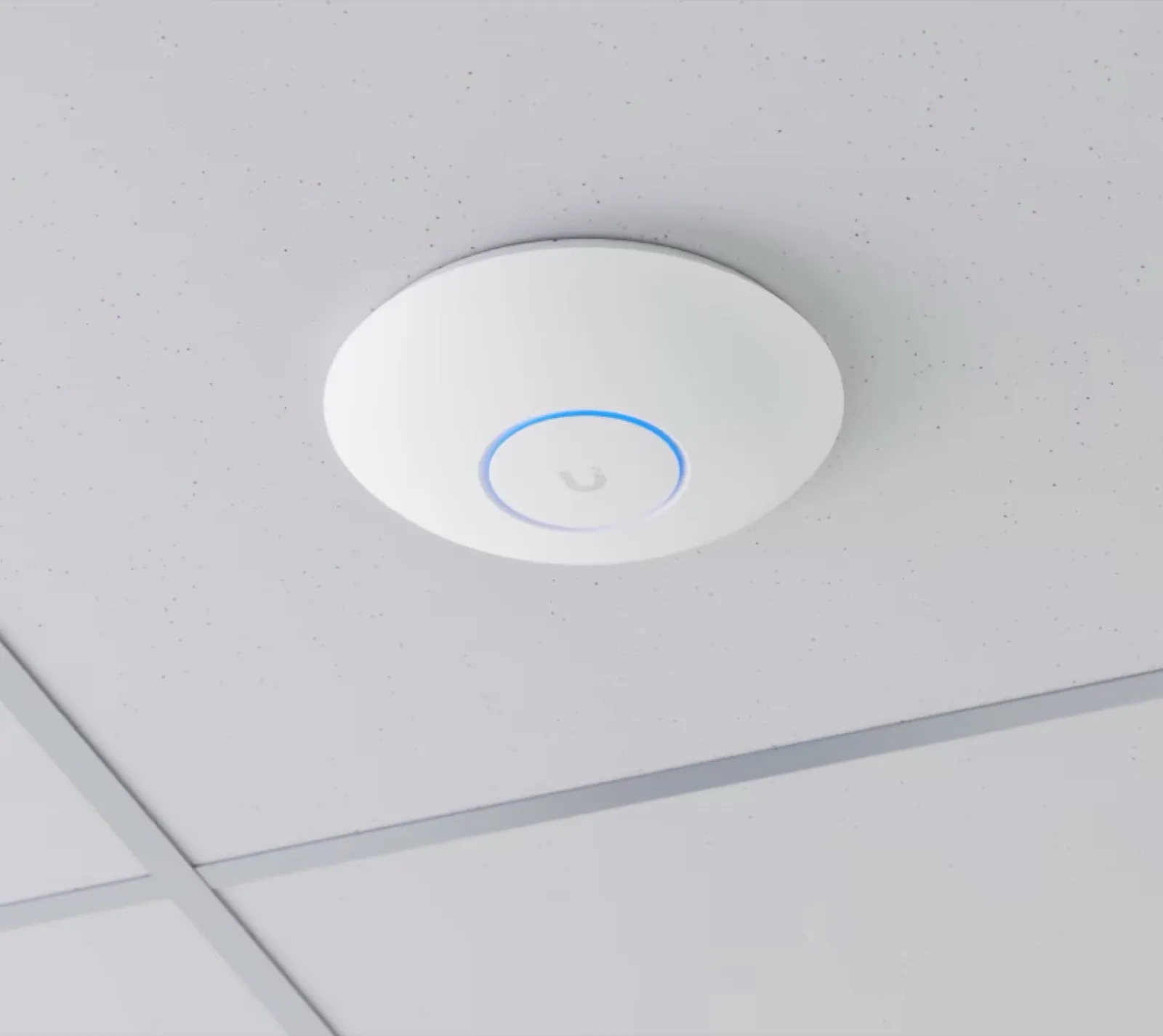 A white ceiling-mounted Wi-Fi access point with a soft blue status ring
